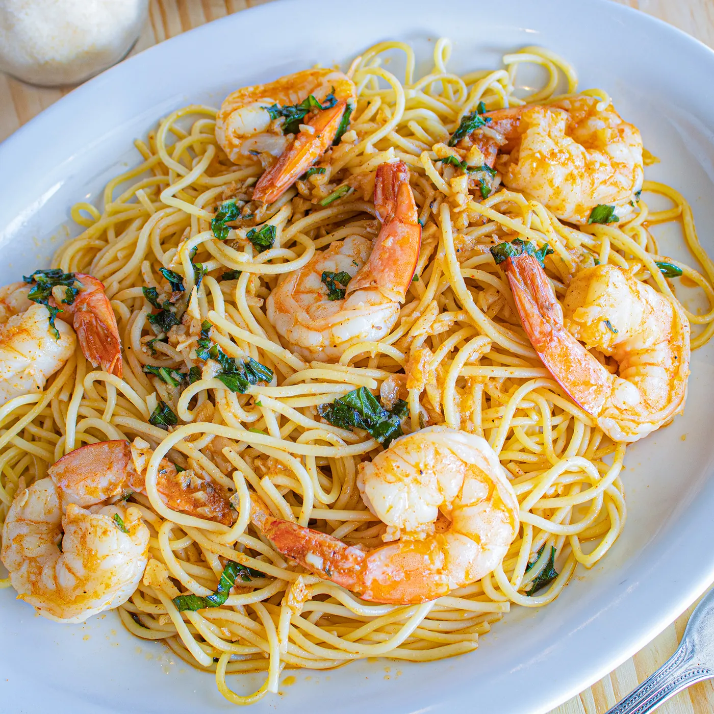 Shrimp scampi over spaghetti in garlic and oil
